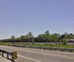 NB ballast train eases uphill to a stop.